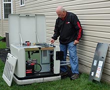 Five Star Power Systems founder Ken Kloster servicing a Cummins standy generator at a home in Millersville, MD