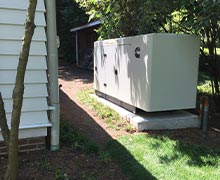 Commercial standby generator installed behind a home in Severna Park, MD