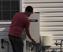 Five Star Power Systems electrician removing front panel of transfer switch