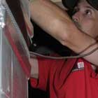 Five Star Power Systems heating technician doing a residential furnace repair