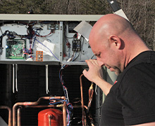 Kenneth Kloster installing a new Rheem rooftop unit in Severn, MD