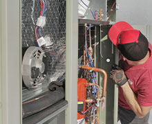 Five Star Power Systems electrician working on wiring a new commercial air conditioner